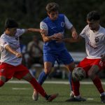 Everetts Adan Fernandez (13) fights for the ball during the EPLWA championships between semi-pro mens soccer team Everett Jets FC and Yakima United at Archbishop Murphy High School in Everett, Washington on Saturday, July 27, 2024. Yakima won, 6-1. (Annie Barker / The Herald)
