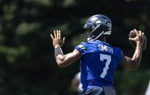 Seahawks quarterback Geno Smith throws a pass during the first day of training camp last Wednesday. (Nick Wagner / The Seattle Times)
