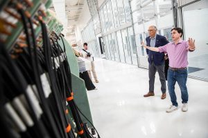 Helion Energy CEO and co-founder David Kirtley talks to Governor Jay Inslee about Trenta, Helions 6th fusion prototype, during a tour of their facility on Tuesday, July 9, 2024 in Everett, Washington. (Olivia Vanni / The Herald)