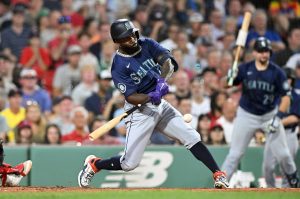 Randy Arozarena, acquired by the Seattle Mariners ahead of the trade deadline, hits an RBI single against the Boston Red Sox during the fifth inning at Fenway Park on Tuesday, July 30, 2024, in Boston. (Brian Fluharty / Getty Images)