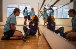 Counselor Emily Crawford, front left, and Kaliya “Ki Ki” Plakio, 8, front right, along with, back left to right, counselor Sanjana Saran, camper Joliviya “Jo Jo” Plakio, 7, and counselor Cora Garling, play with animal masks they made during Camp Prov at Forest Park in Everett, Washington on Wednesday, July 24, 2024. It is a summer camp for kids with disabilities and their siblings (Annie Barker / The Herald)