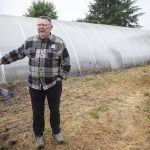 Ron Friesen, of Best Schools Marysville, talks about how much of the space was covered in blackberries on Monday in Marysville. (Olivia Vanni / The Herald)