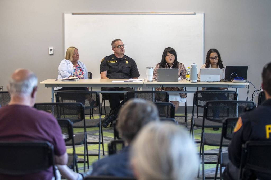 Left to right, senior executive director of the mayors office Lori Cummings, fire chief Dave DeMarco, finance director and treasurer Susy Haugen, and public information officer Simone Tarver sit on a panel during a public information session hosted by the city of Everett to learn about the citys property tax levy on the ballot in August at the Everett Public Library Evergreen Branch in Everett, Washington on Saturday, July 27, 2024. (Annie Barker / The Herald)