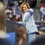 Vice President Kamala Harris, the presumptive Democratic nominee for president, points out Sen. Raphael Warnock (D-Ga.) during a campaign rally in Atlanta on Tuesday, July 30, 2024. Harris’s ascent has delivering an electric shock to a listless Democratic Party that for more than a year struggled to mobilize its base behind President Joe Biden. (Nicole Craine/The New York Times)