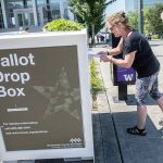 Denise O. turns in ballots at the Snohomish County Campus drop box on Monday, Aug. 5, 2024 in Everett, Washington. (Olivia Vanni / The Herald)