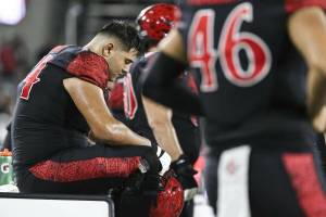Offensive lineman Drew Azzopardi (left), a recent transfer to the University of Washington, reacts on the sideline in San Diego States loss to Nevada on Saturday, Oct. 21, 2023. (Meg McLaughlin / The San Diego Union-Tribune).