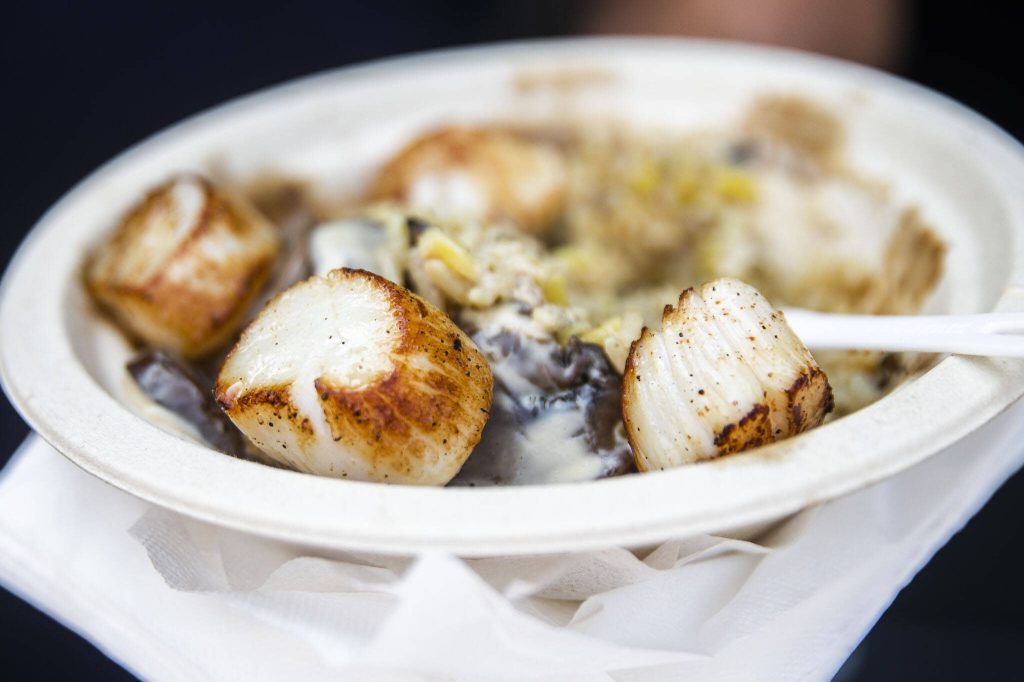 Pan-seared Alaskan weathervane scallops at Taste Edmonds on Friday in Edmonds. (Olivia Vanni / The Herald)