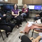 Providence Behavioral Health Urgent Care employees chat after a short training presentation on Wednesday, Aug. 21, 2024 in Everett, Washington. (Olivia Vanni / The Herald)