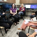 Providence Behavioral Health Urgent Care employees chat after a short training presentation on Wednesday, Aug. 21, 2024 in Everett, Washington. (Olivia Vanni / The Herald)