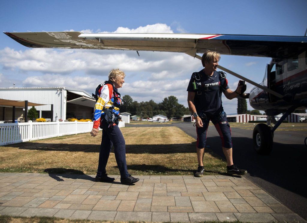 Kim Knor walks out the airplane for her 730th skydive on Wednesday, Aug. 14, 2024 in Snohomish, Washington. (Olivia Vanni / The Herald)