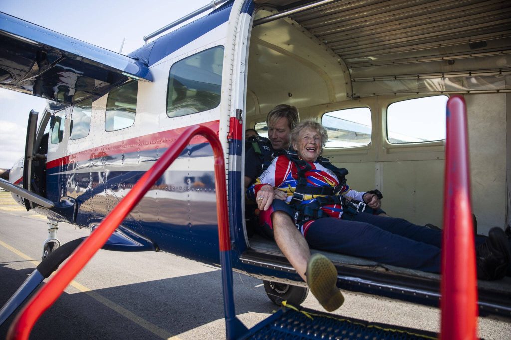 Kim Knor smiles after loading up into the airplane on Wednesday, Aug. 14, 2024 in Snohomish, Washington. (Olivia Vanni / The Herald)