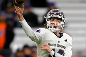 Lake Stevens’ Kolton Matson completes a short pass against Graham-Kapowsin during the WIAA 4A Football State Championship on Saturday, Dec. 2, 2023, at Husky Stadium in Seattle, Washington. (Ryan Berry / The Herald)
