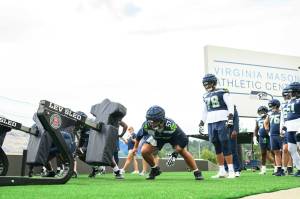New starting center Connor Williams (57) works against the sled at Seattle Seahawks practice at the Virginia Mason Athletic Center in Renton on Monday, August 19, 2024. (Photo courtesy of Edwin Hooper / Seattle Seahawks)