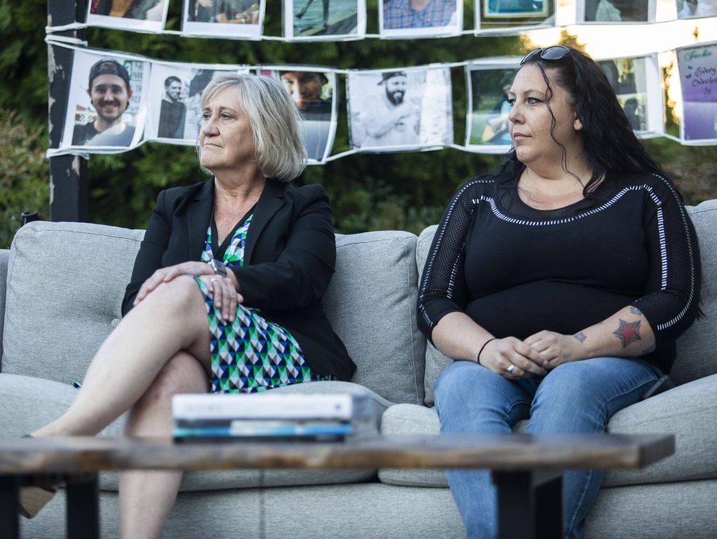 Judge Karen Moore, left, with the adult recovery court, listens during a round table discussion during A Night to Remember, A Time to Act opioid awareness event at the Snohomish County Campus on Thursday, Aug. 29, 2024 in Everett, Washington. (Olivia Vanni / The Herald)