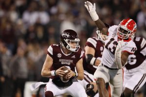 Mississippi State Bulldogs quarterback Will Rogers (2) is pressured by Georgia Bulldogs defensive lineman Mykel Williams (13) during the first quarter at Davis Wade Stadium, Saturday, November 12, 2022, in Starkville, Mississippi. (Jason Getz / Jason.Getz@ajc.com) / Tribune News Services)