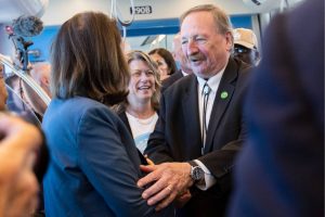 Snohomish County Executive Dave Somers and Senator Maria Cantrell shake hands as they board the 12:30 pm train during the Lynnwood 1 Line extension opening celebrations on Friday, Aug. 30, 2024 in Lynnwood, Washington. (Olivia Vanni / The Herald)