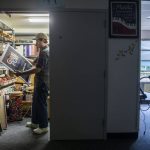 Jack White organizes his music closet at Hazelwood Elementary School on Aug. 26 in Lynnwood. (Olivia Vanni / The Herald)