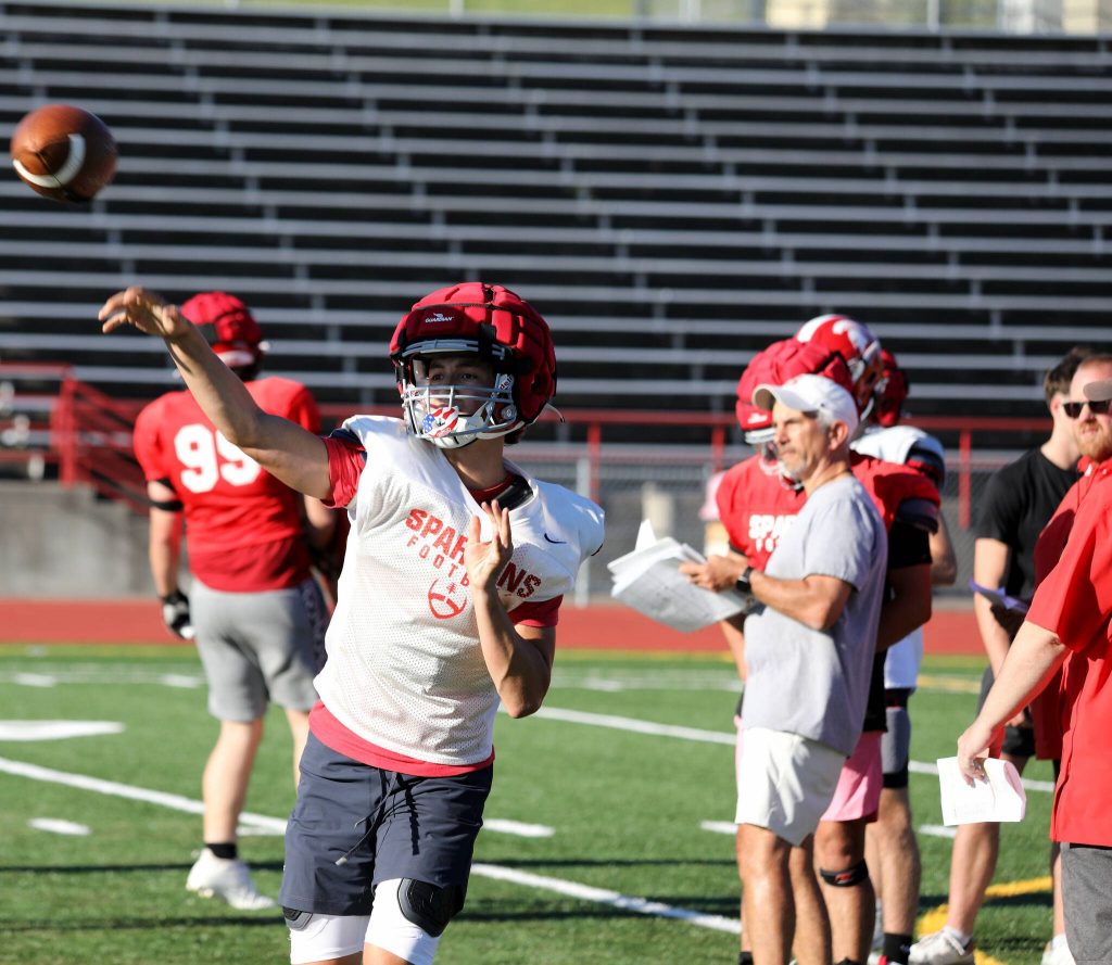 Sophomore quarterback Alex Maldonado throws the football during the Stanwood High School football practice at Bob Larson Stadium in Stanwood, Washington on Aug. 30, 2024. (Taras McCurdie / The Herald)