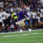 Washington Huskies running back Jonah Coleman runs away from the Weber State defense at Husky Stadium on August 31,2024. (Photography Courtesy of Scott Eklund / Red Box Pictures / Washington Athletics)