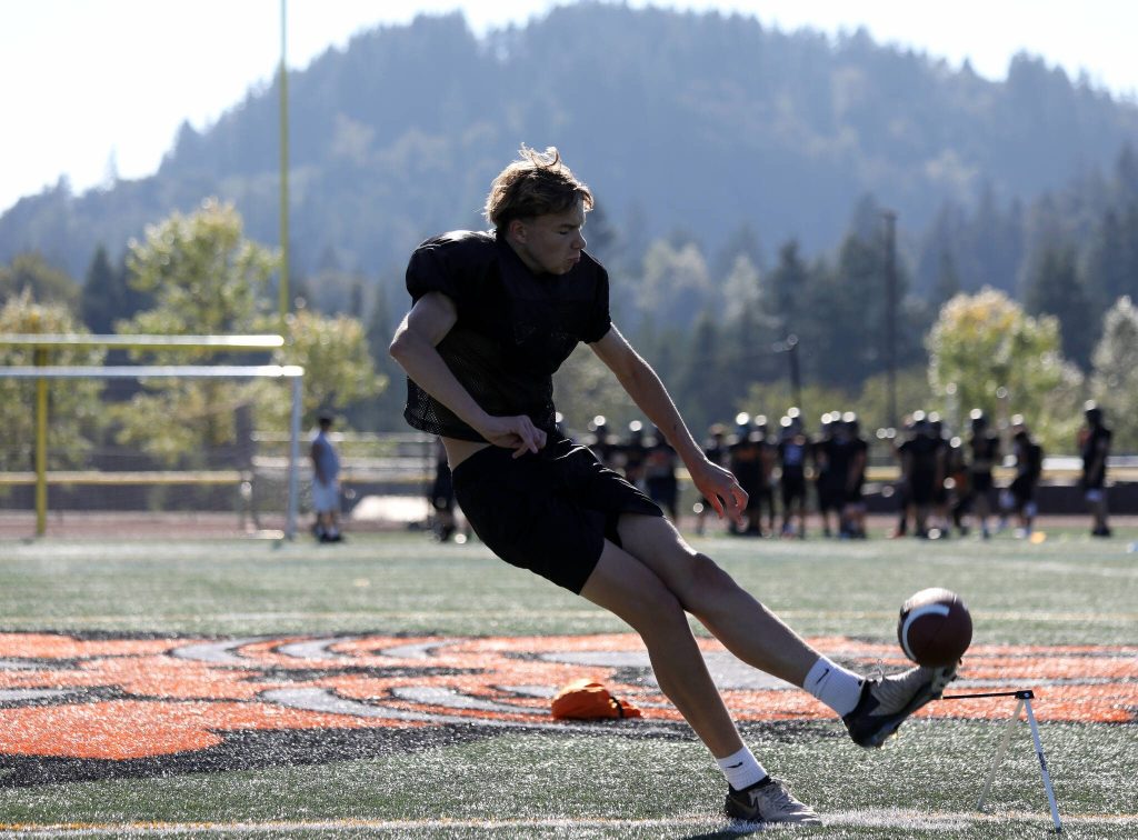 Senior kicker Zach Pazier kicks the football during the Monroe High School football practice in Monroe, Washington on Aug. 29, 2024. (Taras McCurdie / The Herald)