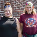 Helping Hands clients Dawn Eastman, left, and Fred Prain, right, outside of the newly expanded facility on Friday, Sept. 6, 2024 in Everett, Washington. (Olivia Vanni / The Herald)