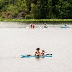 Paddleboarders float on the water at Lake Ballinger on Friday, Aug. 9, 2024 in Lynnwood, Washington. (Olivia Vanni / The Herald)