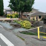 A dump truck crashed into an Edmonds home and knocked out power lines Wednesday morning. (Courtesy of Edmonds Police Department)