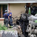 A dump truck crashed into an Edmonds home and knocked out power lines Wednesday morning. (Courtesy of South County Fire)