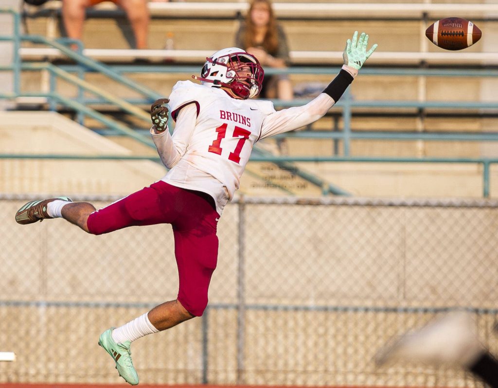 Cascades Marques Reeves leaps in the air to try and catch a pass during the game against Mountlake Terrace on Friday, Sept. 6, 2024 in Edmonds, Washington. (Olivia Vanni / The Herald)
