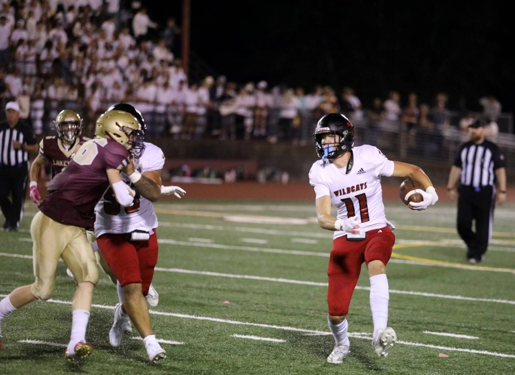 Archbishop Murphy junior wide receiver Henry Gabalis runs with the football en route to scoring a touchdown during the Archbishop Murphy-Lakewood football game at Lakewood High School on Sept. 6, 2024. The Wildcats won 48-24. (Taras McCurdie / The Herald)
