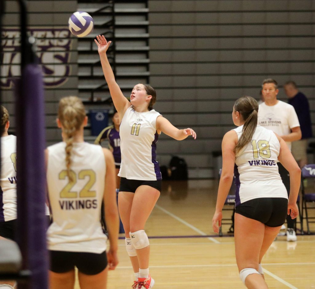 Lake Stevens junior setter Olivia Gonzales tips the volleyball in the season opener against Curtis High School in Lake Stevens, Wash., on Sept. 11, 2024. Curtis won all three sets: 25-19, 25-20 and 25-18. (Taras McCurdie / The Herald)