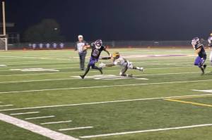Lake Stevens quarterback Kolton Matson scrambles during the Vikings loss to Class 3A No. 1-ranked Bellevue on Sept. 13, 2024 at Lake Stevens H.S. (Aaron Coe / The Herald)