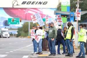 Members of the Boeing Machinists union picket at the intersection of Kasch Park Road and Airport Road on Friday, Sept. 13, 2024, in Everett, Washington. (Michael Henneke / The Herald)
