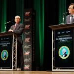 Former congressman Dave Reichert, a Republican, left, and state Attorney General Bob Ferguson, a Democrat, right, on stage during the second debate of the governors race on Wednesday in Spokane. (Bill Lucia/Washington State Standard)