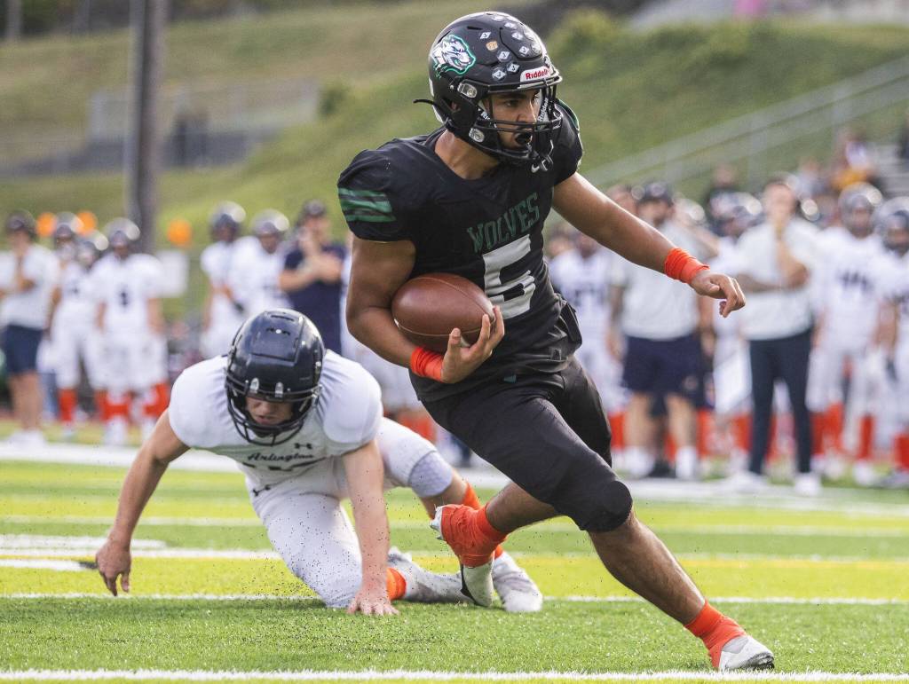 Jacksons Haseeb Rassulli runs the ball into the end zone for a touchdown during the game against Arlington on Friday, Sept. 20, 2024 in Everett, Washington. (Olivia Vanni / The Herald)