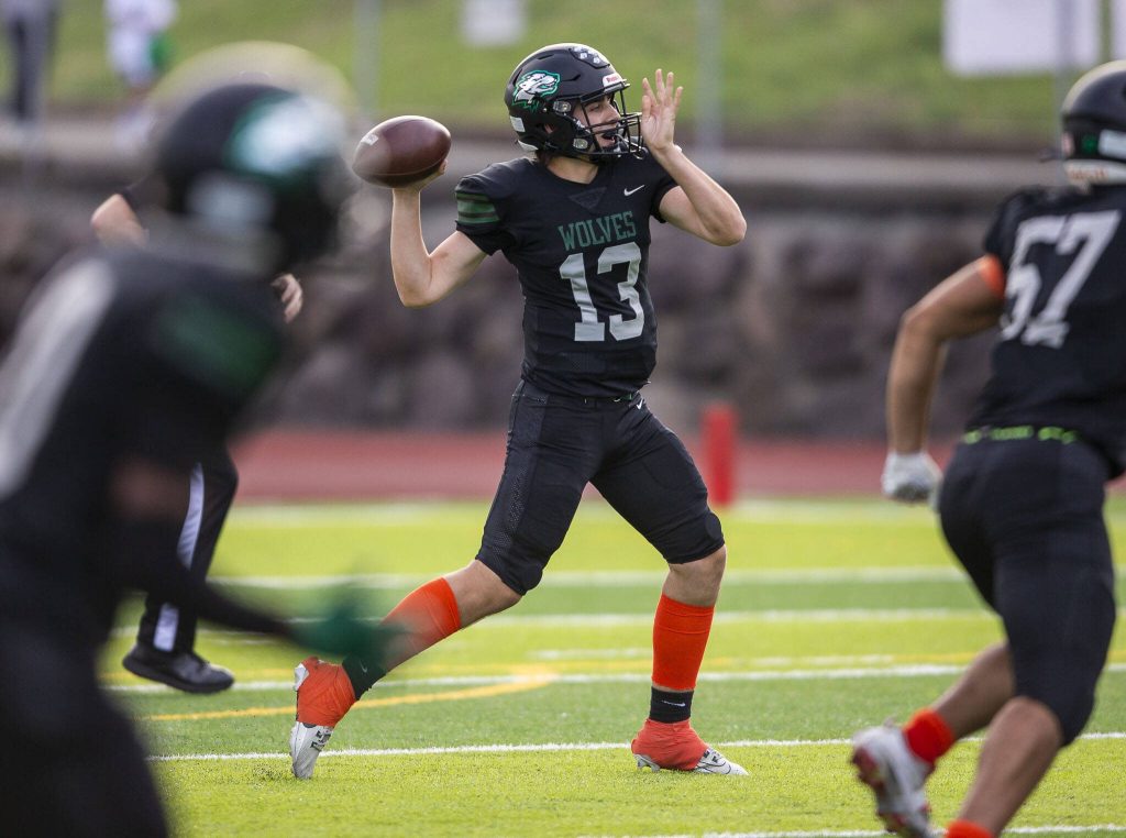 Jacksons Colby Bossert throws the ball during the game against Arlington on Friday, Sept. 20, 2024 in Everett, Washington. (Olivia Vanni / The Herald)