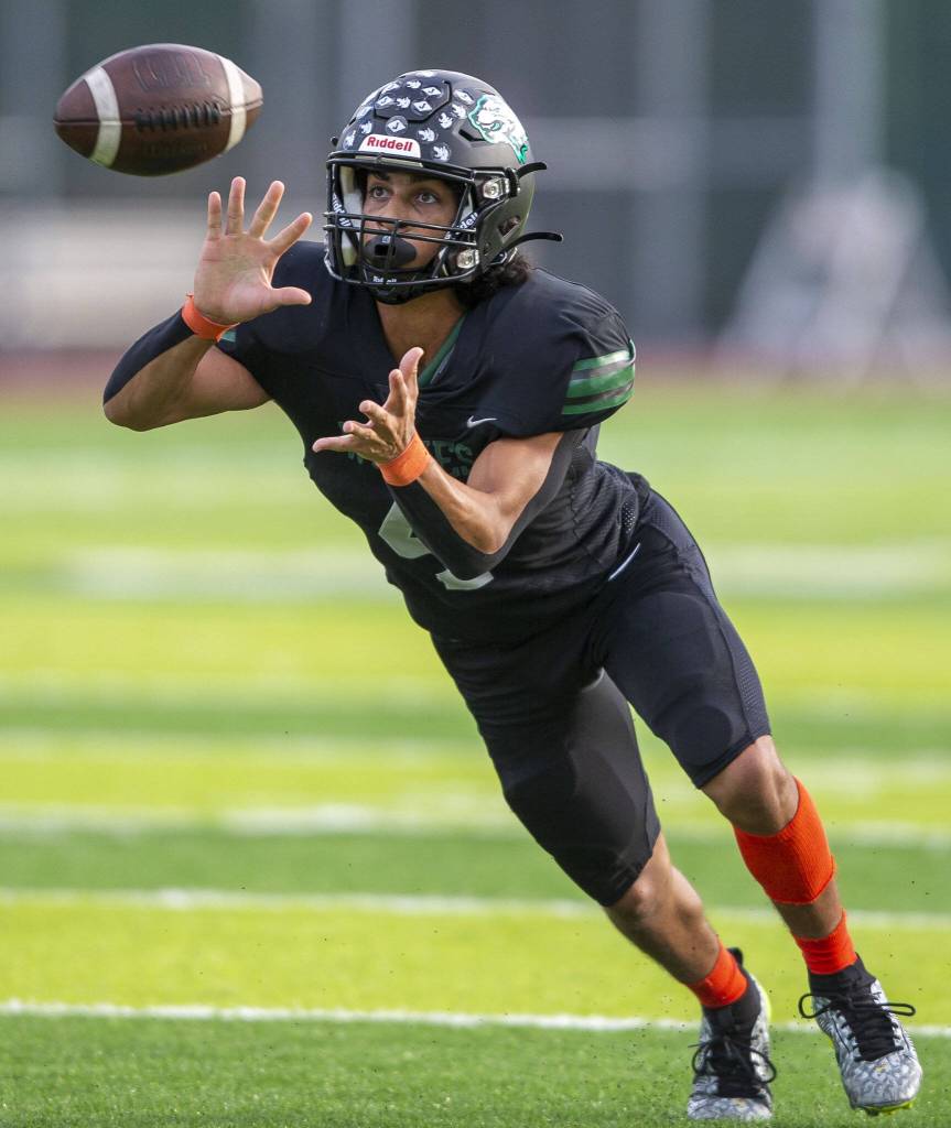 Jacksons Seamus Williams picks off a throw during the game against Arlington on Friday, Sept. 20, 2024 in Everett, Washington. (Olivia Vanni / The Herald)