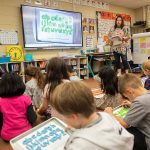 Mrs. Hildenbrand runs through a spelling exercise with her first grade class on the classroom’s Boxlight interactive display board funded by a pervious tech levy on Tuesday, March 19, 2024 in Marysville, Washington. (Olivia Vanni / The Herald)