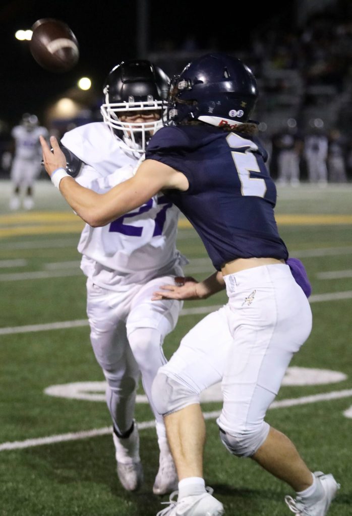 Arlington High School senior wide receiver Chase Deberry attempts to catch the football during the Wesco 4A game against Kamiak High School at John C. Larson Stadium, in Arlington, Washington, on Sept. 27, 2024. Arlington won 52-7. (Taras McCurdie / The Herald)