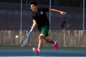 Jackson’s Ben Lee scrambles after the ball during a doubles match again Kamiak on Monday, Sept. 30, 2024 in Mill Creek, Washington. (Olivia Vanni / The Herald)