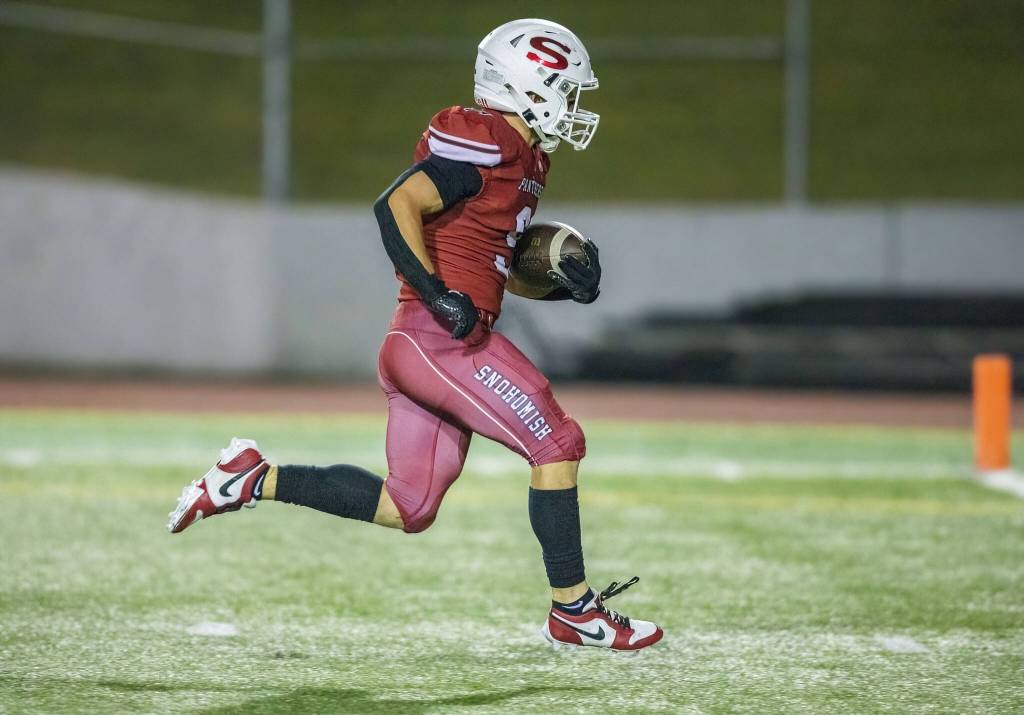 Snohomishs Brody Strandt runs the ball into the end zone for a touchdown during the game against Mount Vernon on Friday, Oct. 4, 2024 in Snohomish, Washington. (Olivia Vanni / The Herald)