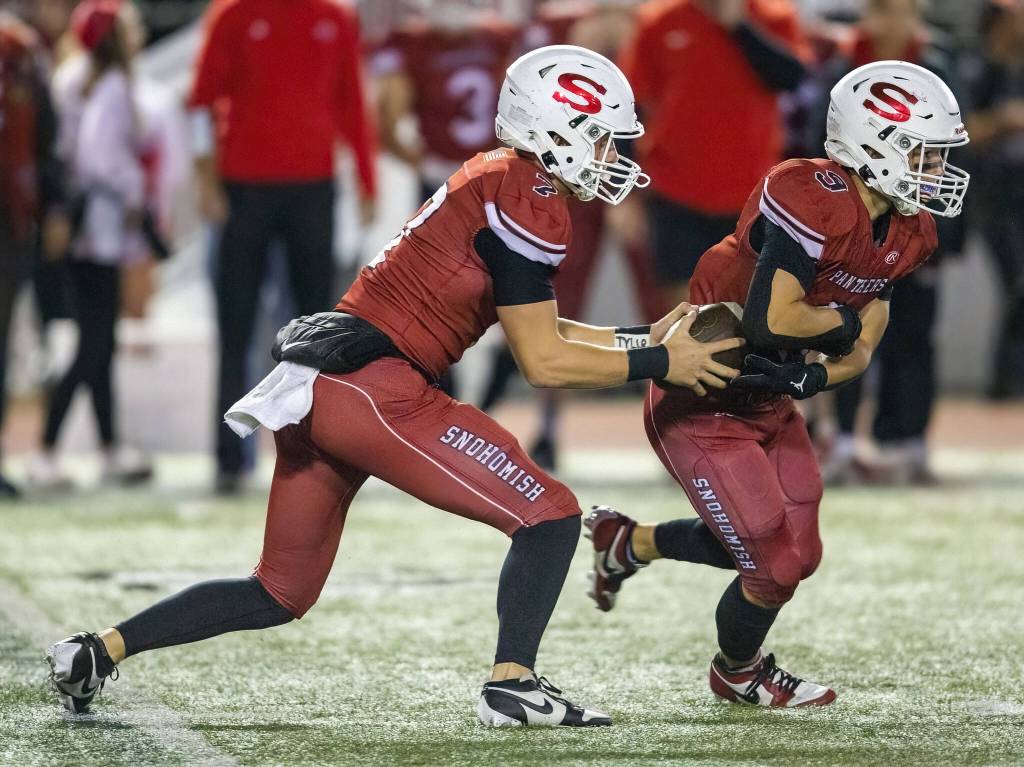 Snohomishs David Hammer fakes a handoff to Brody Strandt during the game against Mount Vernon on Friday, Oct. 4, 2024 in Snohomish, Washington. (Olivia Vanni / The Herald)
