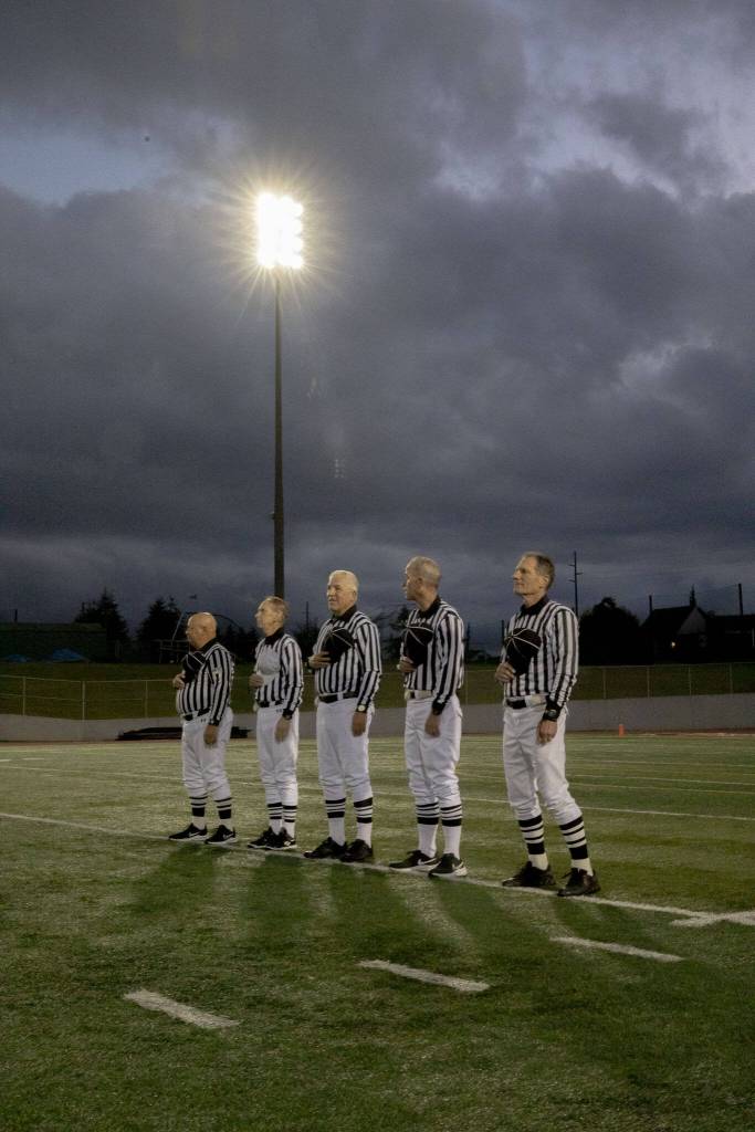 Ross Noe (left to right), Tom Freal, Dean Corcoran, Steve Jensen and Jim Brotten stand for the national anthem Friday, Oct. 4, 2024 in Snohomish, Washington. (Olivia Vanni / The Herald)