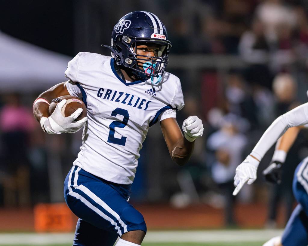 Glacier Peaks Kevin Bonshe runs with the ball after making an interception during a game against Lake Stevens in Lake Stevens, Wash., on Friday, Oct. 4, 2024. (John Gardner / Pro Action Image)