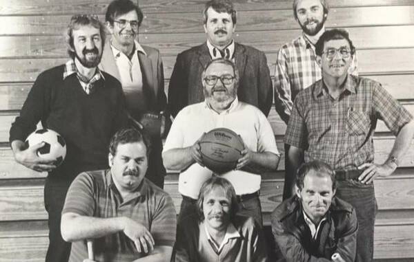 Former Herald columnist Larry Henry (front row, right) poses for a photo with The Heralds sport department. (Herald archive photo)