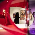 A person pauses to look at an art piece during the Schack Art Centers 50th anniversary celebration on Thursday, Oct. 10, 2024 in Everett, Washington. (Olivia Vanni / The Herald)
