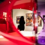 A person pauses to look at an art piece during the Schack Art Center’s 50th anniversary celebration on Thursday, Oct. 10, 2024 in Everett, Washington. (Olivia Vanni / The Herald)