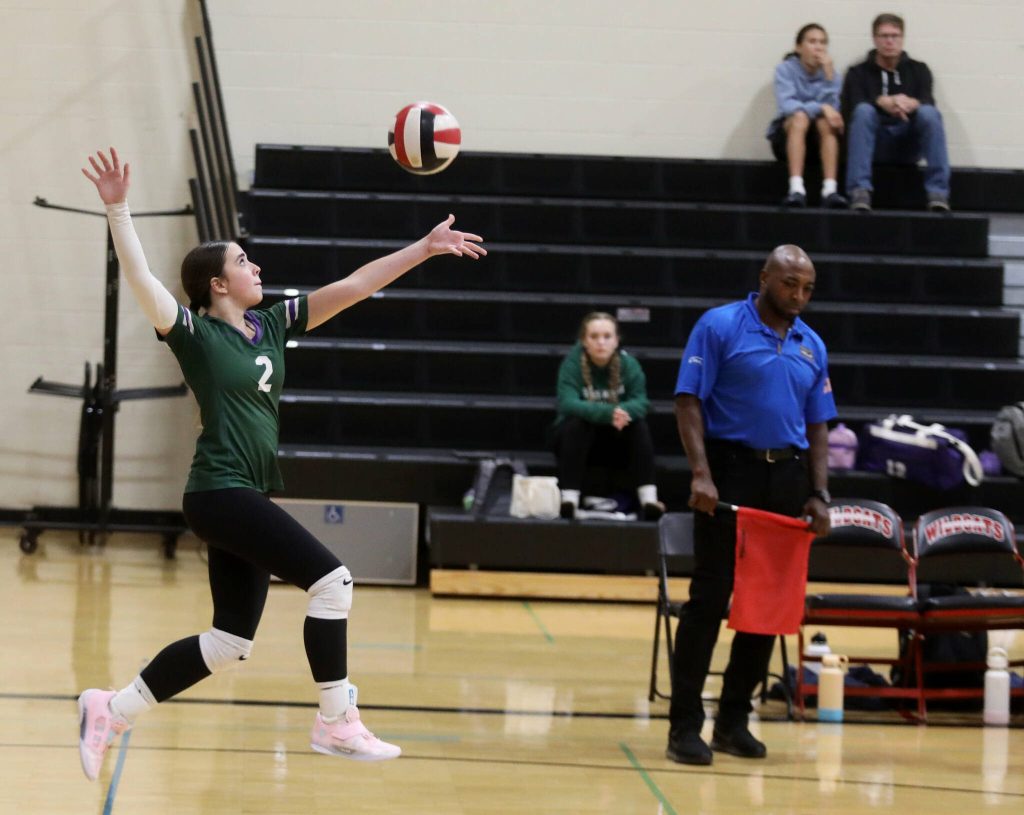 Edmonds-Woodway junior setter Neeva Travis serves the ball in a Wesco 3A/2A South matchup against Archbishop Murphy in Everett, Wash., on Oct. 9, 2024. The unranked Wildcats won 3-1 and handed the No. 10 Warriors their first loss of the season. (Taras McCurdie / The Herald)