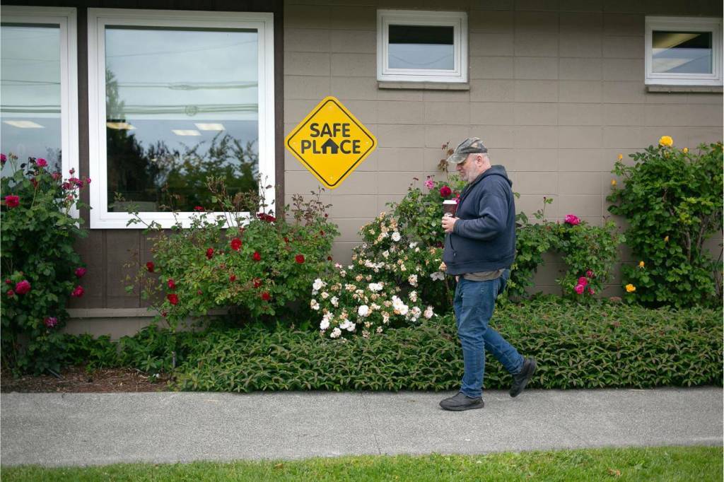 George Beard walks into the Stanwood Library with coffee in hand on Thursday, May 23, 2024, in Stanwood, Washington. (Ryan Berry / The Herald)