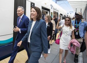 U.S. Sen. Maria Cantwell (center) walks through the Lynnwood Center Station to board the train during opening celebrations the Link light rail stations opening on Aug. 30, in Lynnwood. (Olivia Vanni / The Herald file photo)